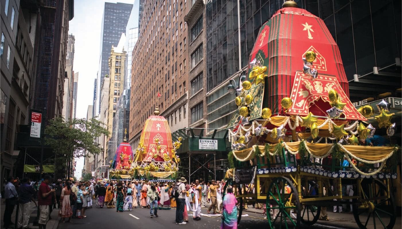 ISKCON Ratha Yatra chariots moving through a city